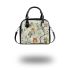 Pattern of owls perched on tree branches shoulder handbag