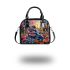 Psychedelic colorful frog on the forest floor shoulder handbag