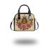 Queen bee sitting on top of honeycomb shoulder handbag