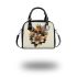 Queen bee with a crown sitting on flower shoulder handbag