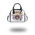 Queen bee with a crown sitting on flower shoulder handbag