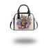 Queen bee with a crown sitting on flower shoulder handbag