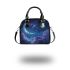 The purple butterflies dance gracefully in the sky shoulder handbag