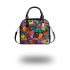 Vibrant and colorful painting of fish shoulder handbag
