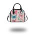 Vibrant pattern of pink and turquoise butterflies shoulder handbag